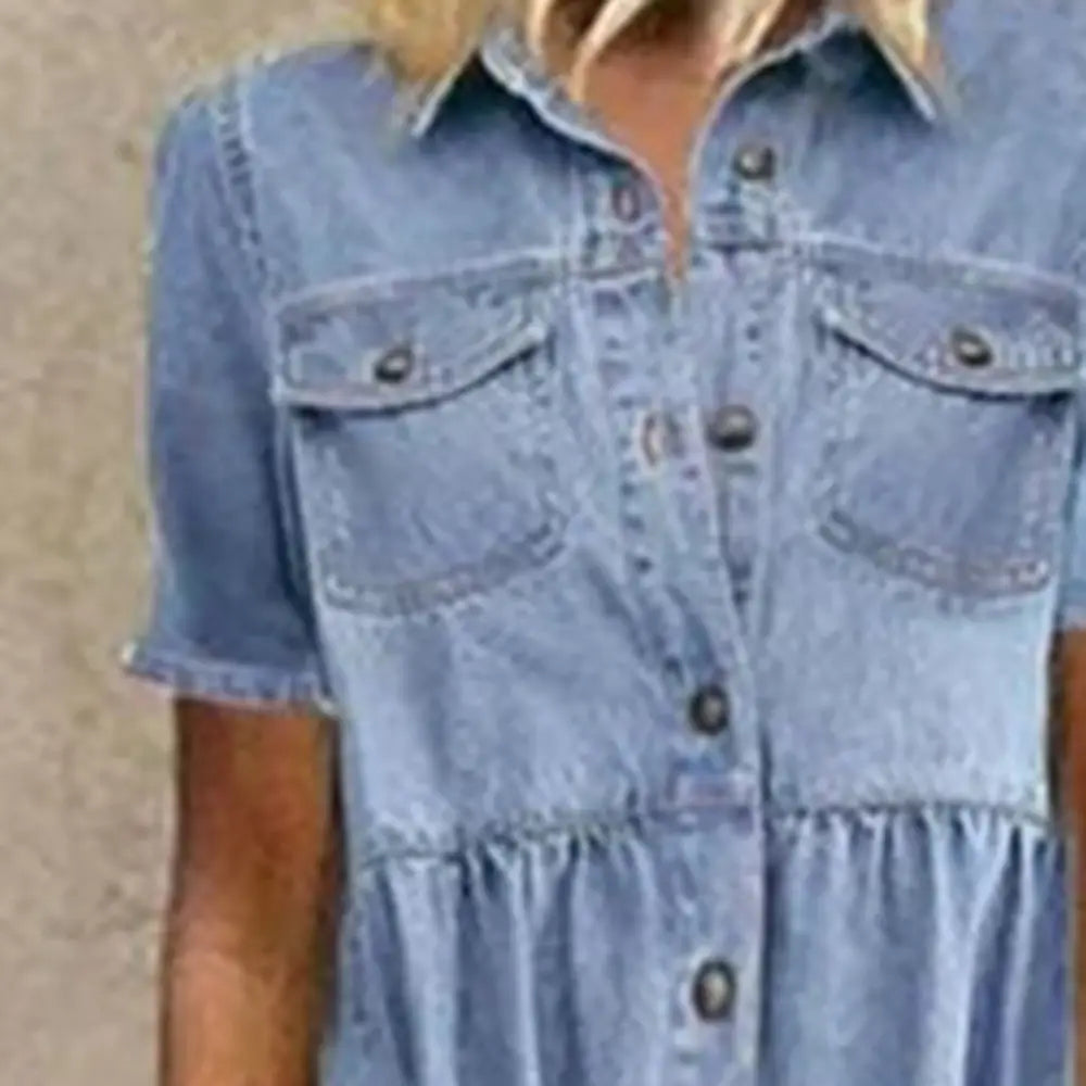 Light blue denim maxi shirt dress with short sleeves and front button closure from the distressed multi buckle tiered collection.