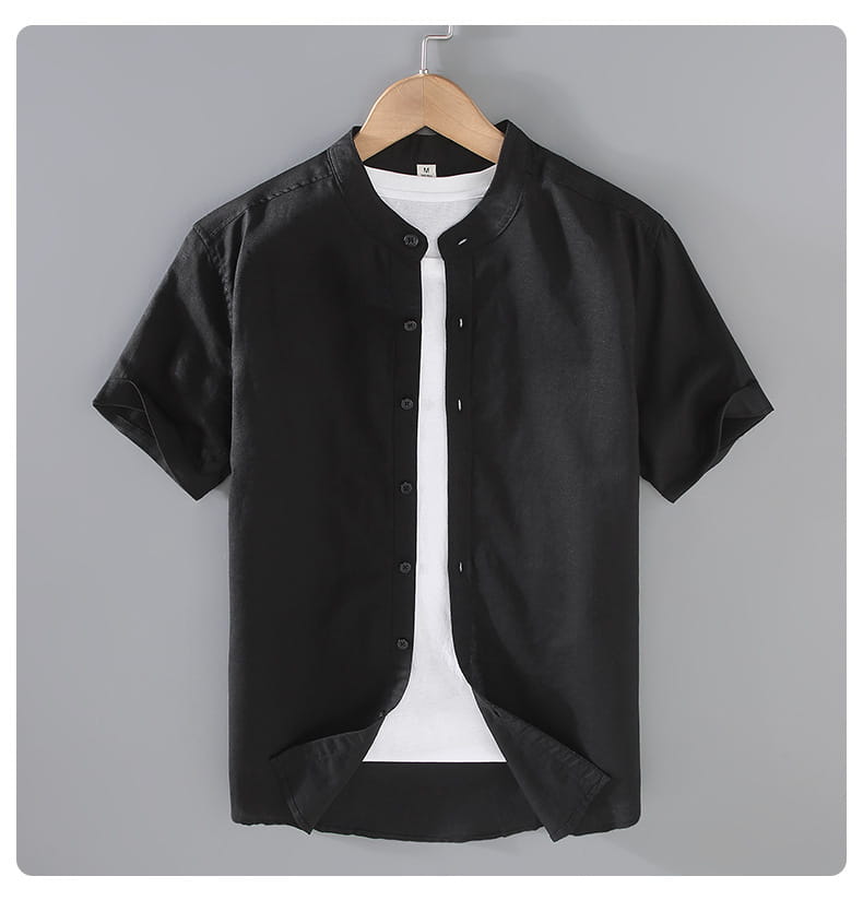Black men linen short sleeve shirt with mandarin collar hanging on a wooden hanger.