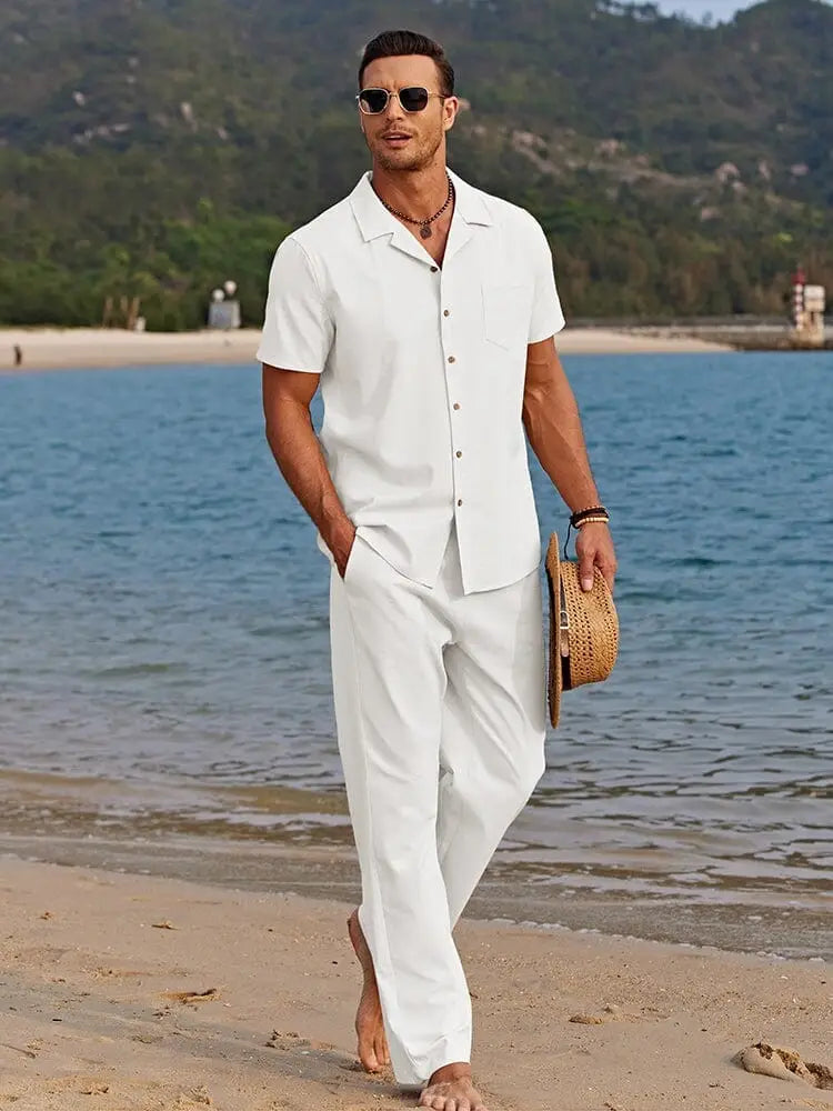 White short-sleeved button-up beach shirt with a collar and relaxed fit in a casual summer outfit set for men.