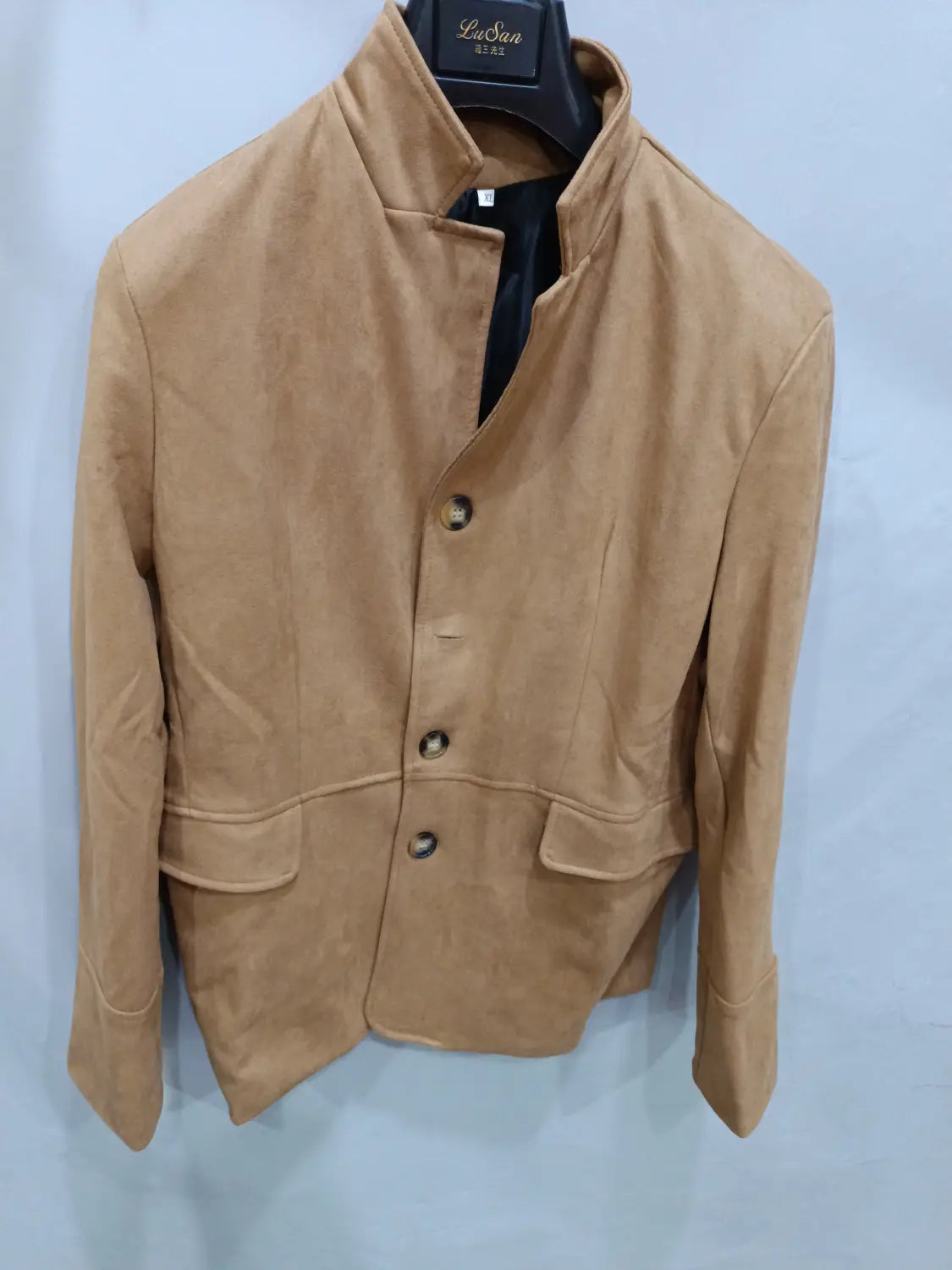men’s tan suede retro casual blazer jacket featuring a stand-up collar and three dark buttons.