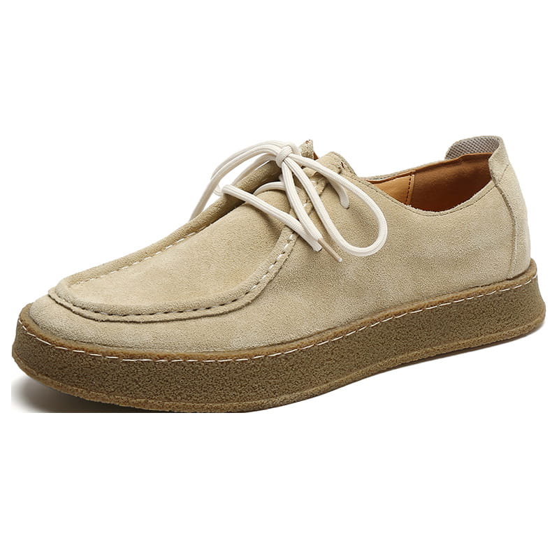 Beige suede British style casual lace up leather shoe with white laces and brown rubber sole.