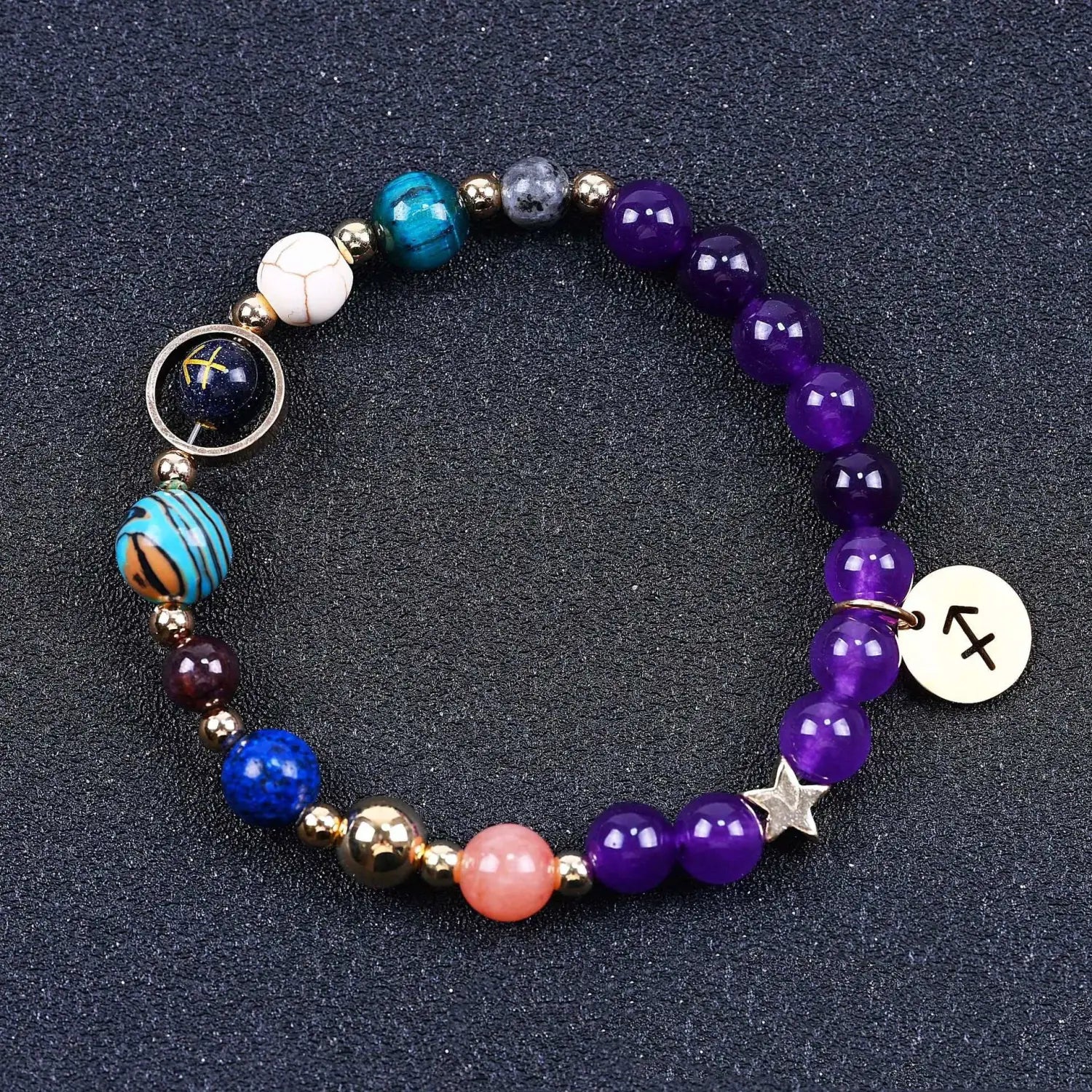Natural amethyst and agate twelve zodiac beaded bracelet featuring purple blue teal and peach gemstones with gold-toned metal accents and a silver star charm.