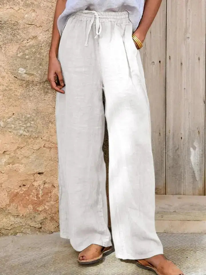 Lightweight drawstring linen wide leg pants in soft off-white with an elastic waistband.