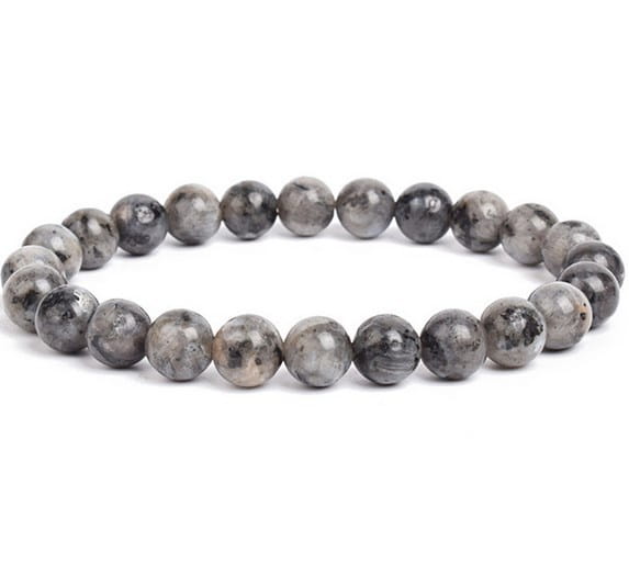 A unisex 8mm polished agate and amethyst stretch bracelet featuring smooth round gray beads with subtle black and white veining.