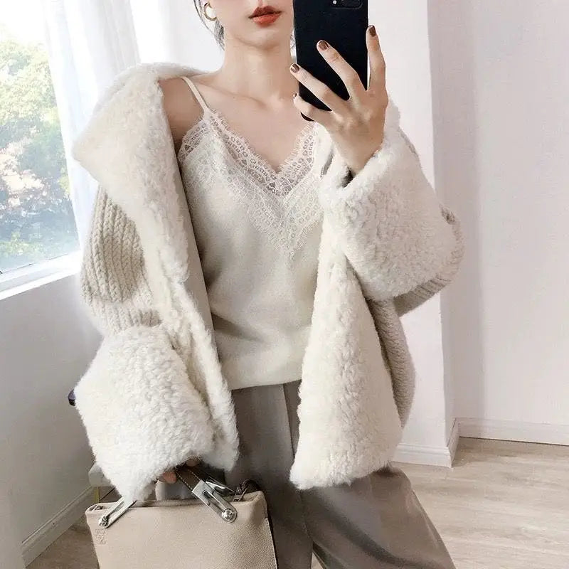 Cream-colored lace trim camisole top featuring a shearling-lined knit cardigan with a cozy textured exterior and soft fluffy interior.