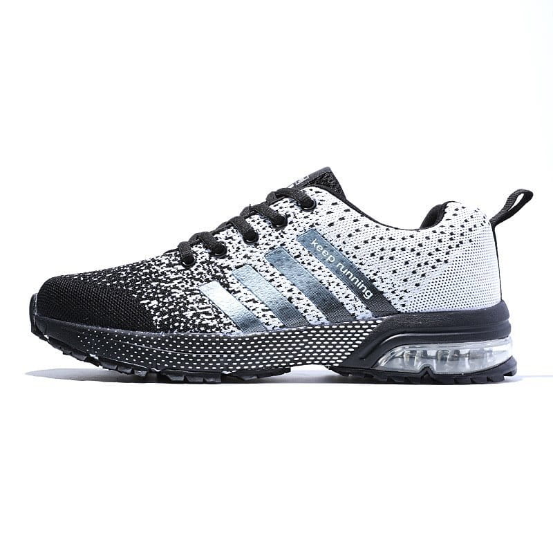 Men’s air cushion knit running sneakers in black and white with silver stripes featuring a transparent air cushion in the sole.