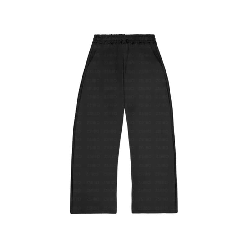 Pantalon noir à jambes larges, avec un tissu texturé doux et une ceinture élastiquée, issu de l’ensemble oversize unisexe streetwear comprenant un sweat à capuche et un pantalon de survêtement.