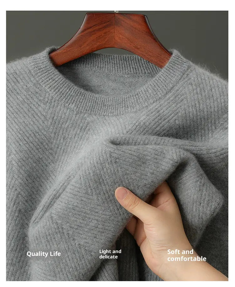Men’s herringbone knit cashmere pullover sweater in soft heather gray with a ribbed crew neckline and textured weave.