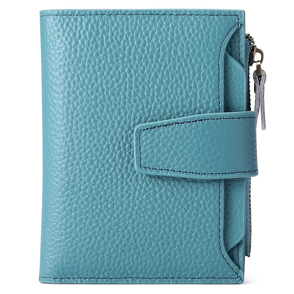 A teal textured leather RFID wallet with flap closure zipper pocket and anti theft feature.