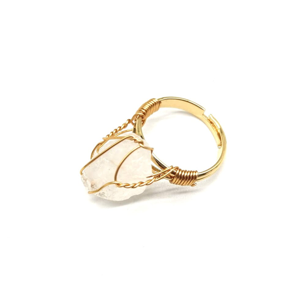 Handcrafted raw gemstone gold wire wrapped adjustable ring featuring a delicate gold wire wrapped design with a raw translucent white quartz stone.