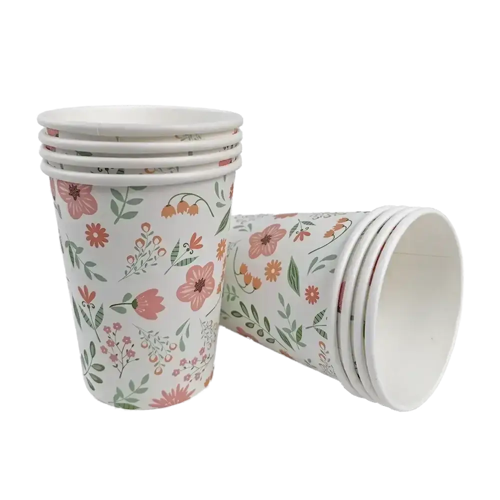 Stack of easter bunny paper cups with a delicate floral pattern in soft pink orange and green hues on white background