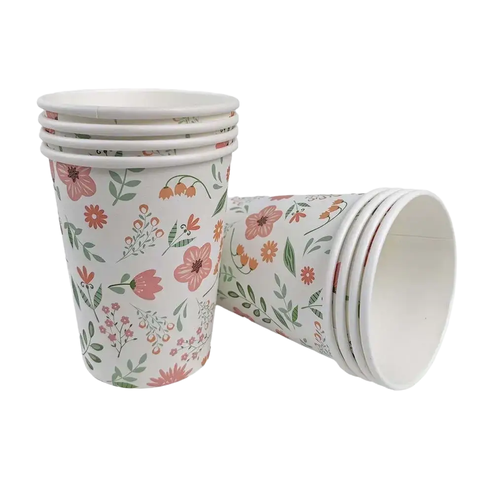 A stack of eight Easter bunny paper cups with a delicate pink orange and green floral pattern on white background