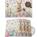 Easter bunny placemat with tan rabbit in blue bow tie surrounded by pastel eggs and floral linen table mat set