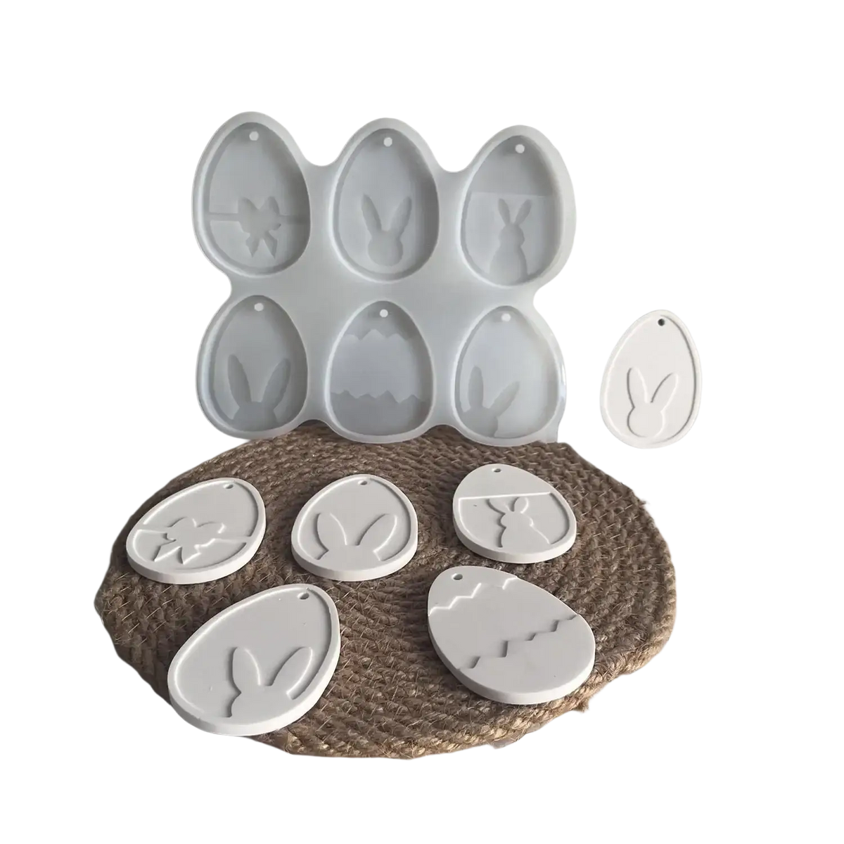 White silicone easter bunny resin pendant mold with floral and bunny designs for crafting Easter egg shapes
