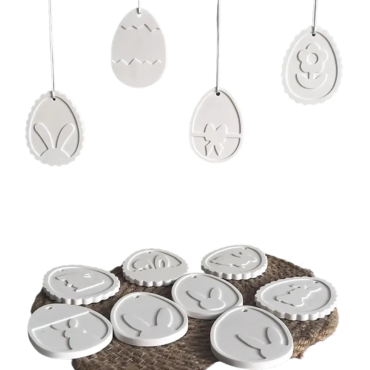 White ceramic easter egg ornaments with embossed bunny flower and zigzag designs made using easter bunny silicone pendant mold