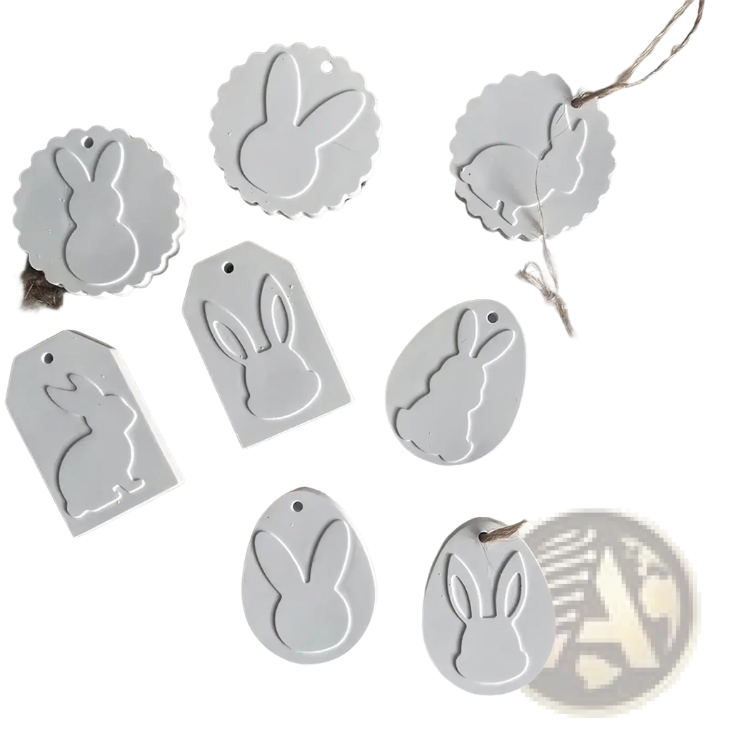 White bunny-shaped silicone resin pendant mold with smooth matte finish and scalloped edges in various sizes