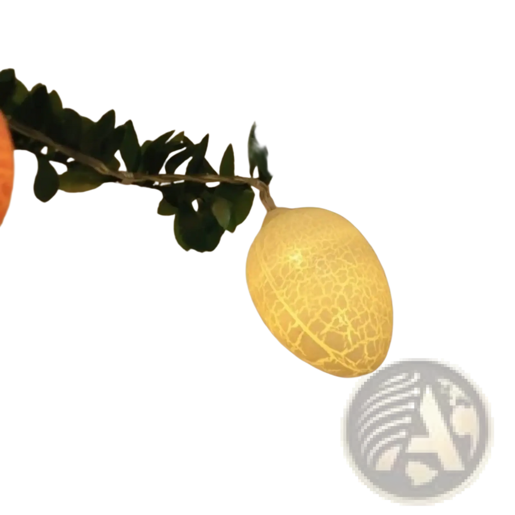 A glowing yellow egg-shaped led light with a crackled texture hanging on a green leafy garland for easter decor