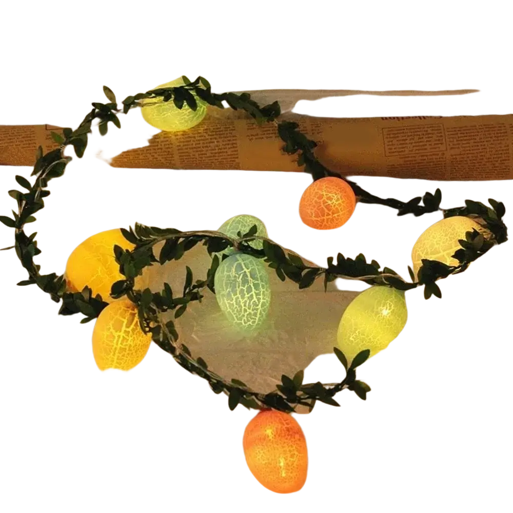 String of colorful crackled plastic egg-shaped led lights nestled in green leafy garland for easter decoration