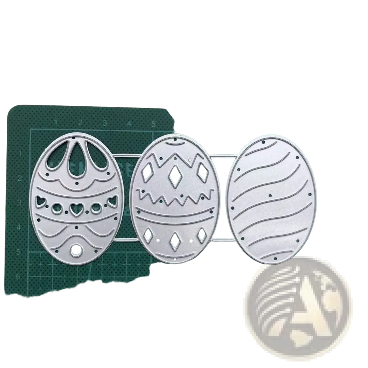 Set of three silver metal easter egg cutting dies with intricate patterns for card making and decoration