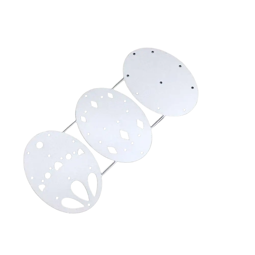 White metal easter egg-shaped die-cutting template with intricate cut-out patterns and pre-drilled holes for card making