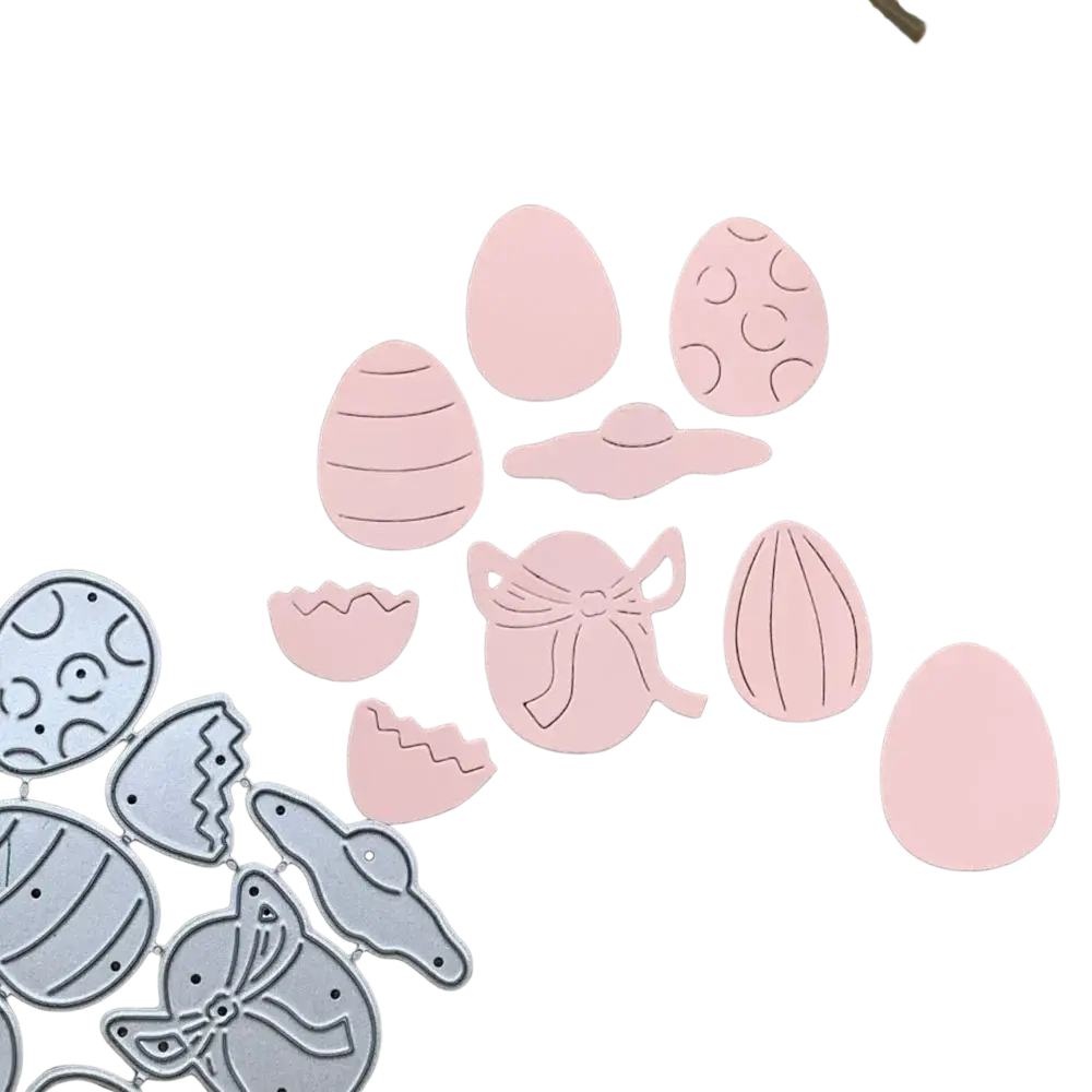 Easter egg metal cutting dies in pink and silver featuring die-cut eggs with patterns bows and broken egg pieces for scrapbooking