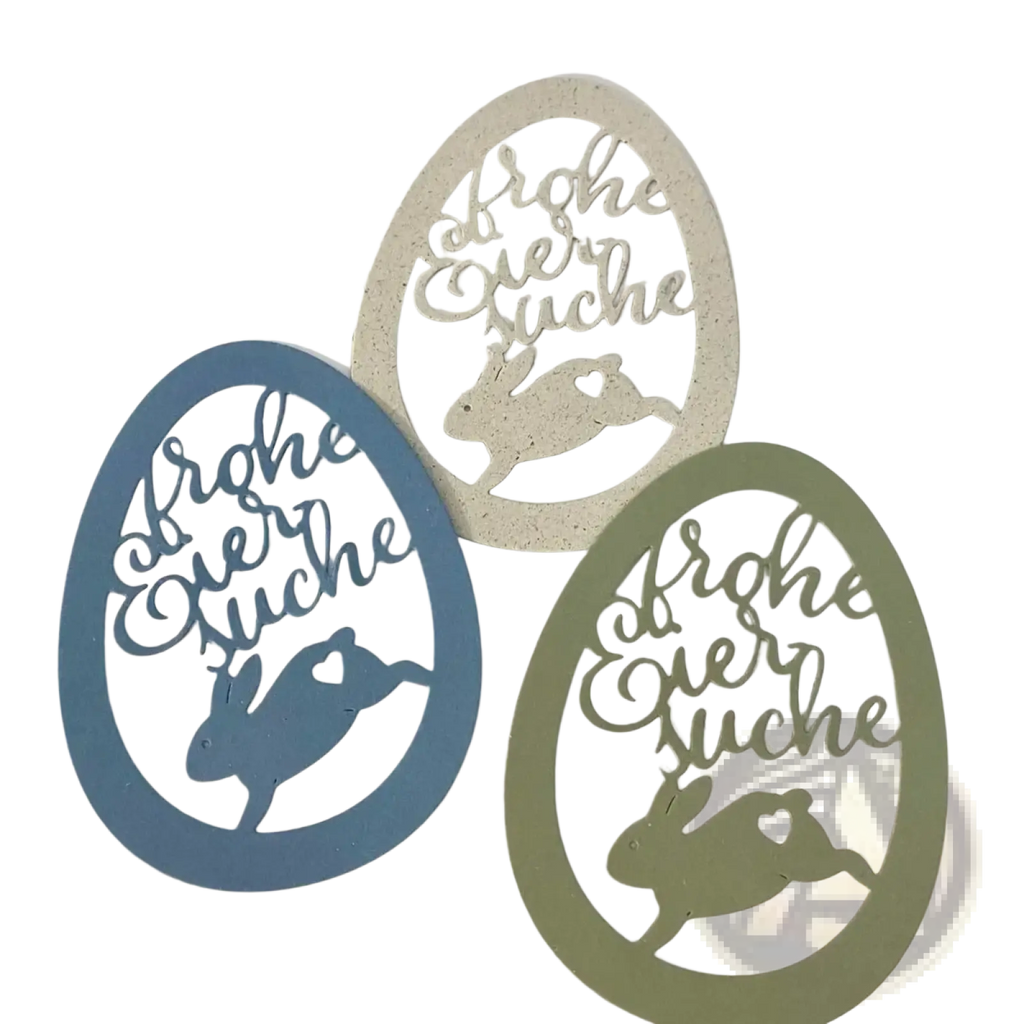 Three oval-shaped easter egg rabbit baby cutting dies in white paper featuring frohe oster suche in cursive script
