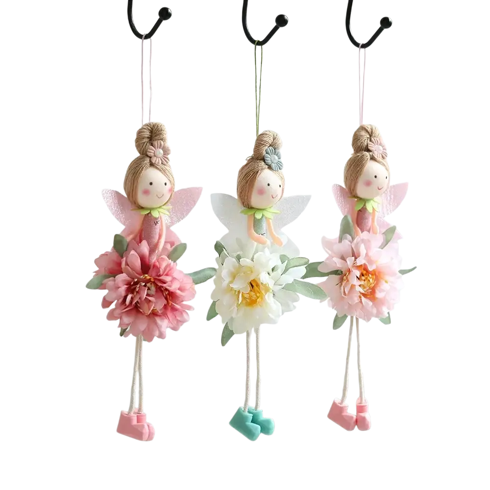 Three delicate Easter flower fairy pendant dolls with pastel floral felt skirts hanging from hooks