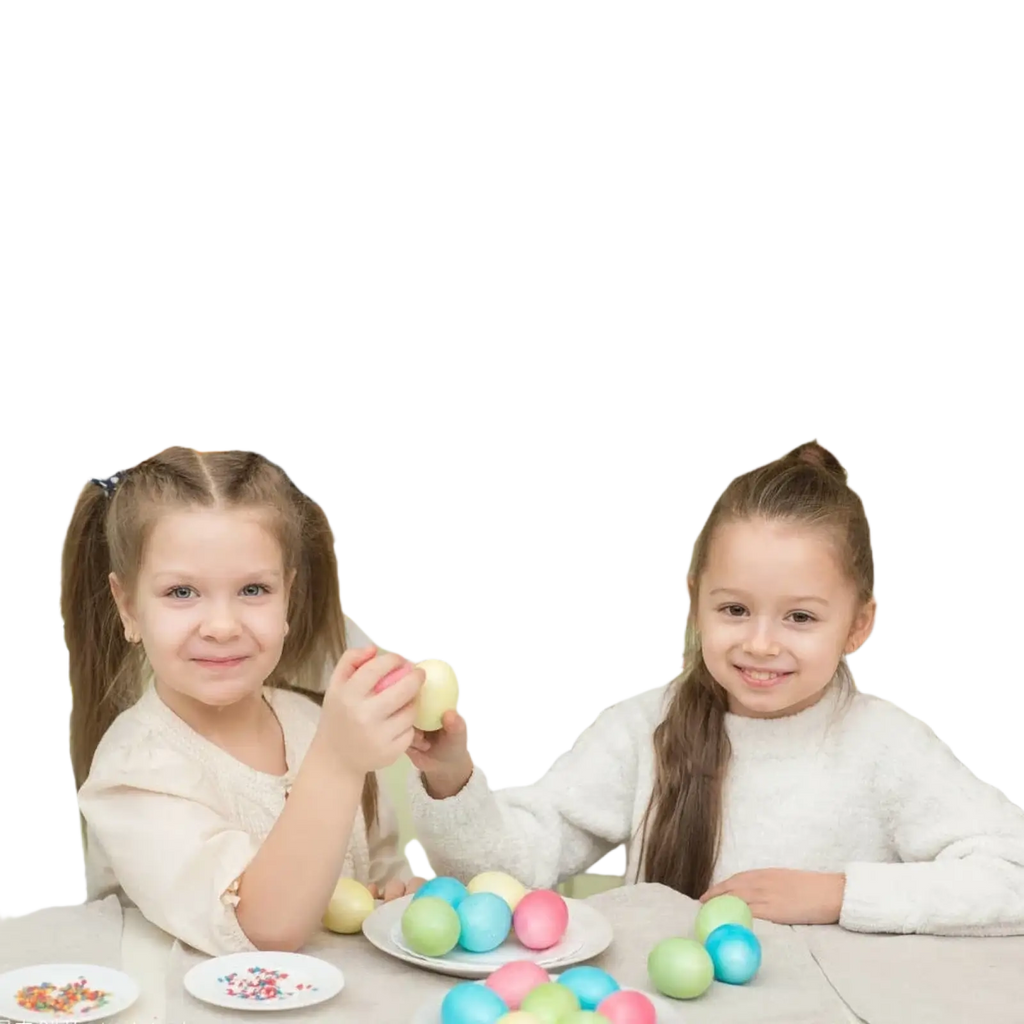 Pastel-colored easter eggs on a white plate as part of an easter photography backdrop with spring grass bunny prop