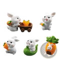 Set of eight white resin Easter rabbit figurines in cute poses with carrots and leafy greens for miniature decor