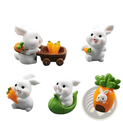 Set of eight white resin Easter rabbit figurines in cute poses with carrots and leafy greens for miniature decor