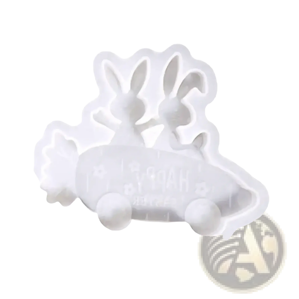 White silicone mold shaped like two rabbits in a car with happy engraving for resin and soap crafting