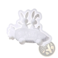 White silicone mold shaped like two rabbits in a car with happy engraving for resin and soap crafting