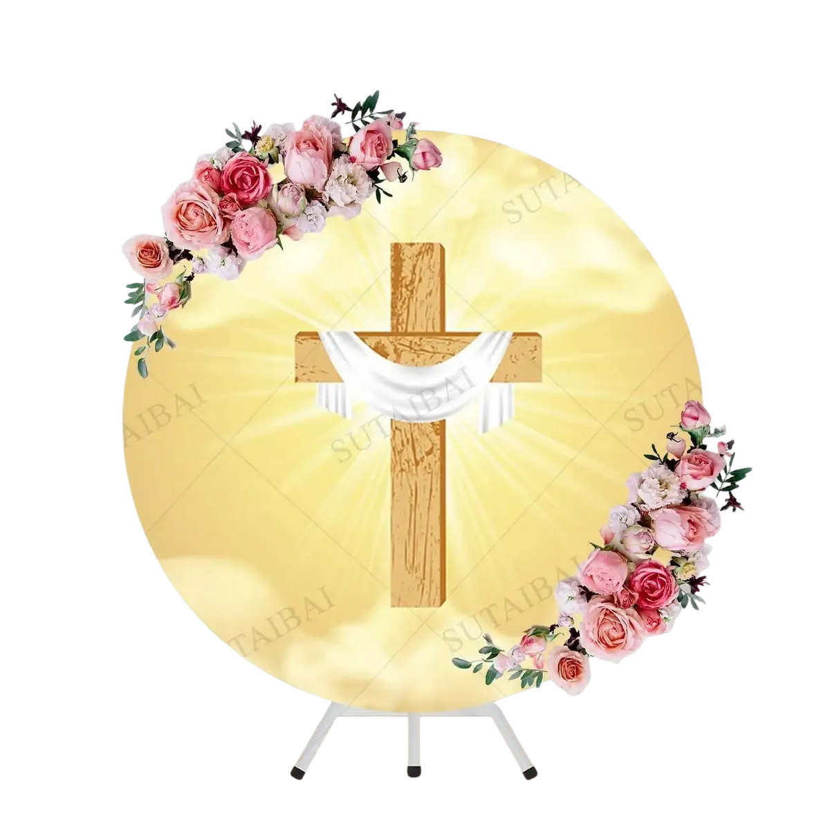 Wooden cross with white fabric draped over it on a golden round backdrop decorated with pink and cream roses for easter