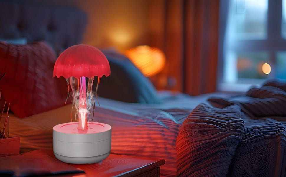 a glowing red jellyfish-shaped humidifier with translucent tentacles and a white cylindrical base featuring 7 color led and essential oil diffuser functions