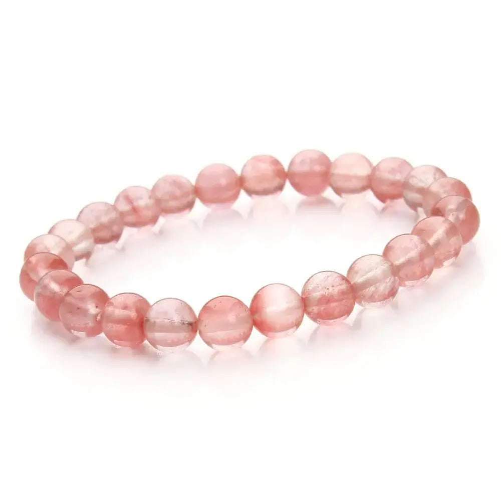 A natural polished gemstone and agate beaded bracelet featuring delicate pink rose quartz beads with smooth rounded stones and a subtle translucent sheen.