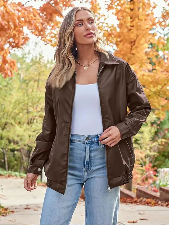 Brown faux leather bomber jacket with ribbed cuffs and hem in an oversized relaxed fit design.