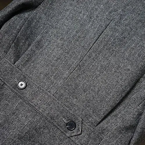 Gray herringbone wool blazer featuring subtle texture and two matching buttons from the British vintage woolen coat slim tweed blazer collection.