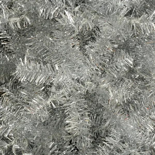 shiny silver tinsel branch of a silver pre-lit artificial christmas tree with led lights