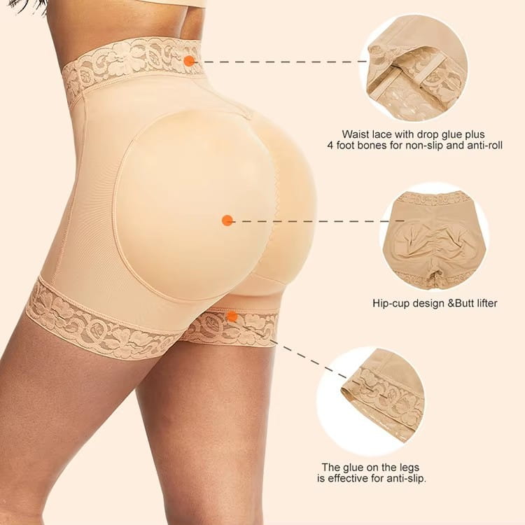 Beige lace-trimmed high waist shapewear shorts with padded hip-cup butt lifter design and adhesive for secure fit shown from the back side.