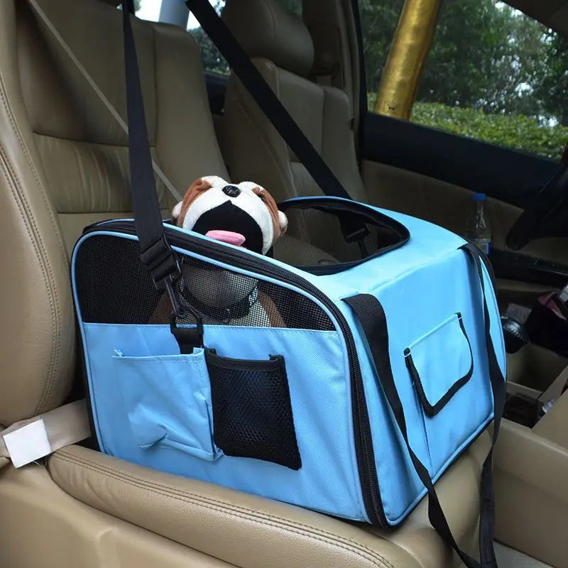 Light blue pet carrier backpack for small dogs and cats with black mesh panels and straps featuring a front pocket and side storage compartments.