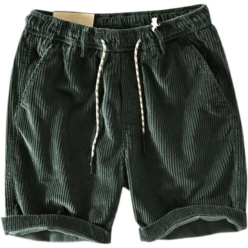 Men’s premium ribbed dark green corduroy shorts with a drawstring waistband and rolled cuffs.