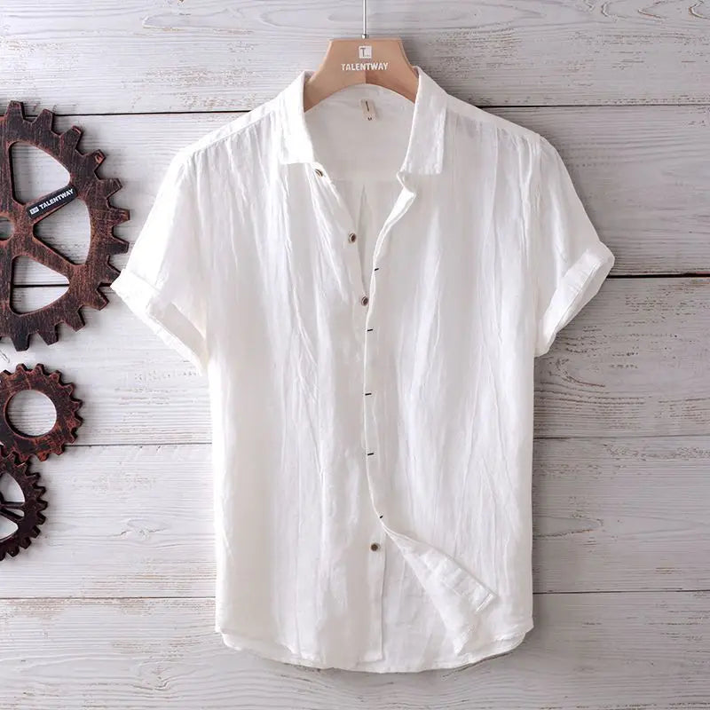 Men’s retro distressed linen short sleeve shirt in white with a relaxed fit hanging on a wooden hanger.