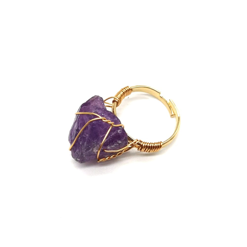 Handcrafted raw gemstone gold wire wrapped adjustable ring featuring a gold wire-wrapped raw faceted purple amethyst stone.
