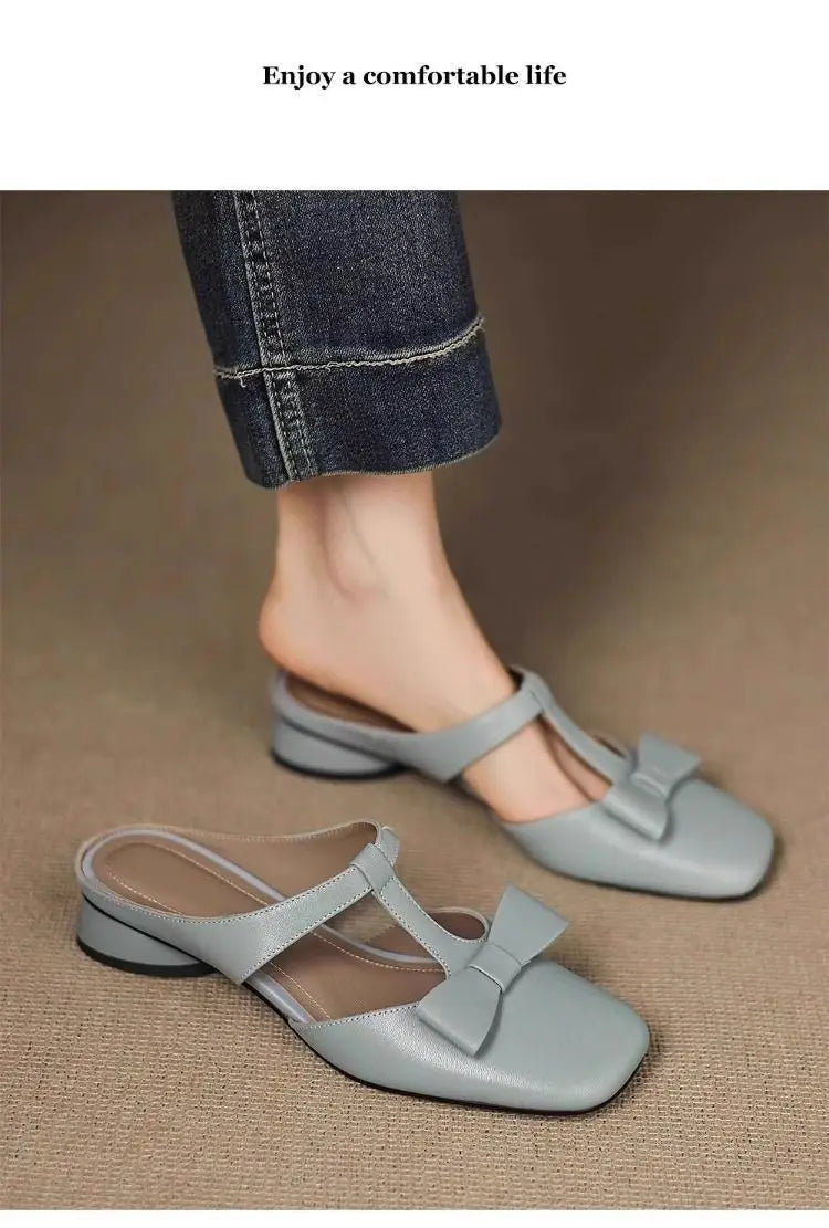 light gray leather mule flats for women with a square toe and a decorative bow on the front