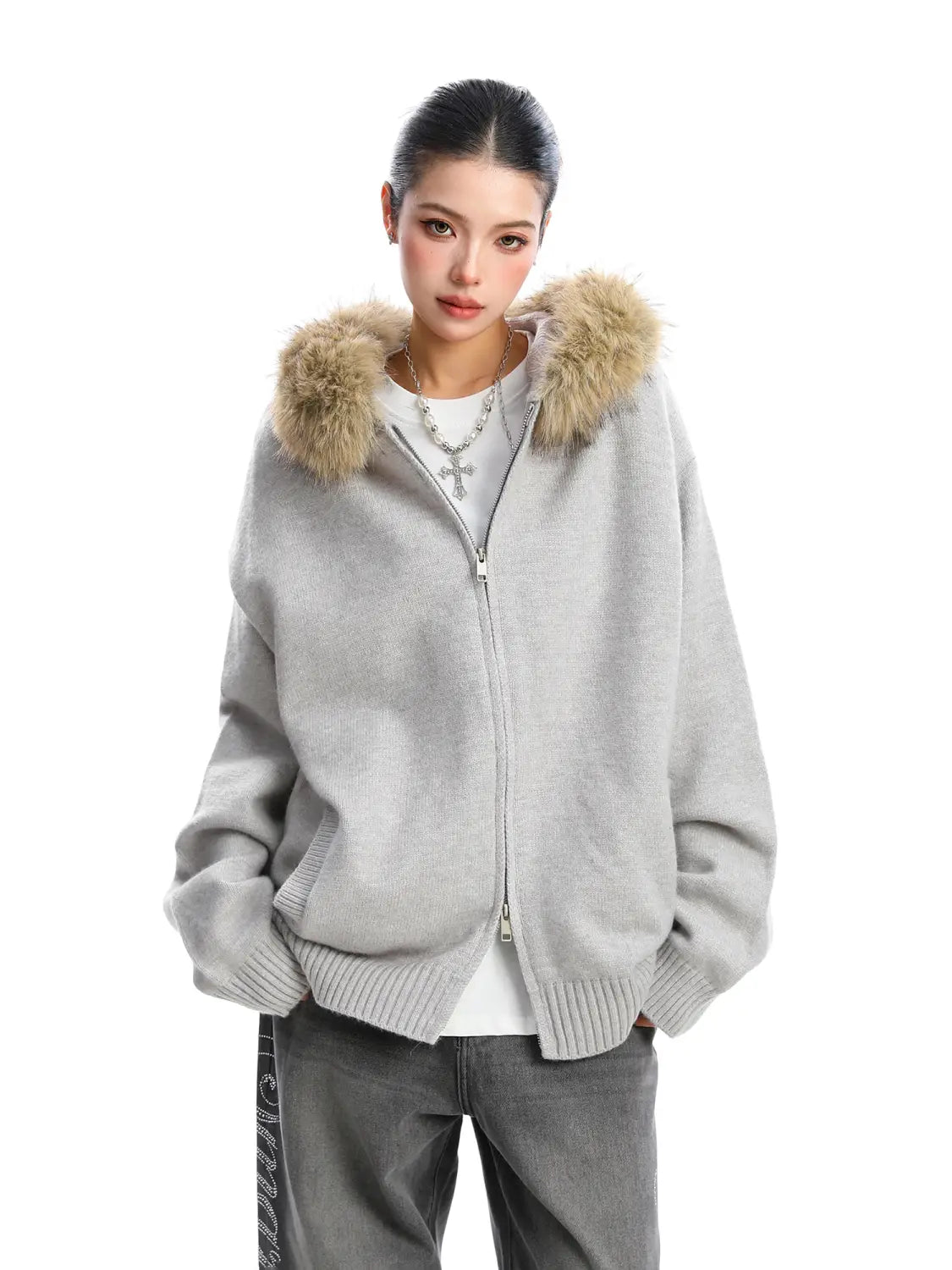 Light gray knit zip-up hoodie with a fluffy tan fur-lined hood featured in a fur collar hooded knit coat.