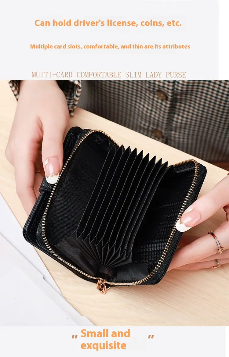Black leather mini organ wallet with button closure featuring a slim design, gold zipper, and multiple card slots.