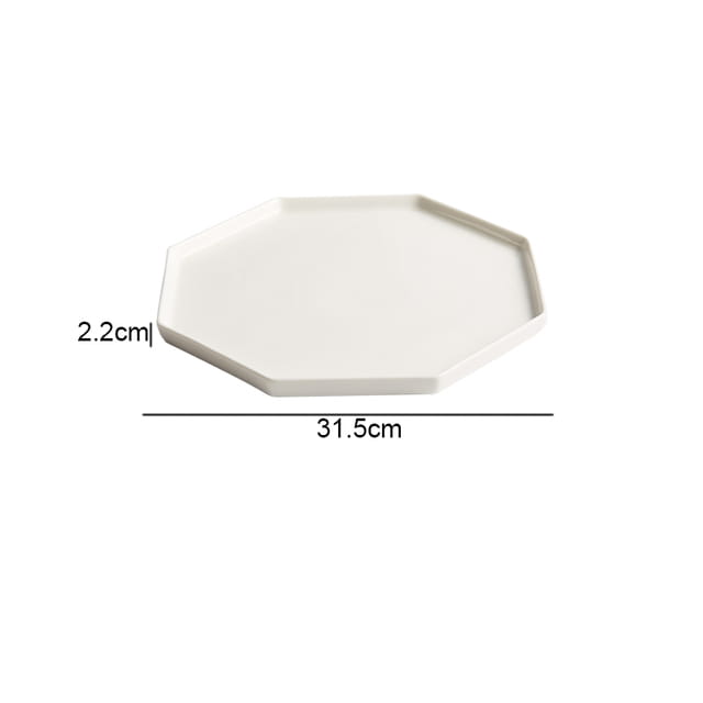 a sleek off-white octagonal ceramic appetizer bowl with a matte textured finish and smooth edges in a minimalist design