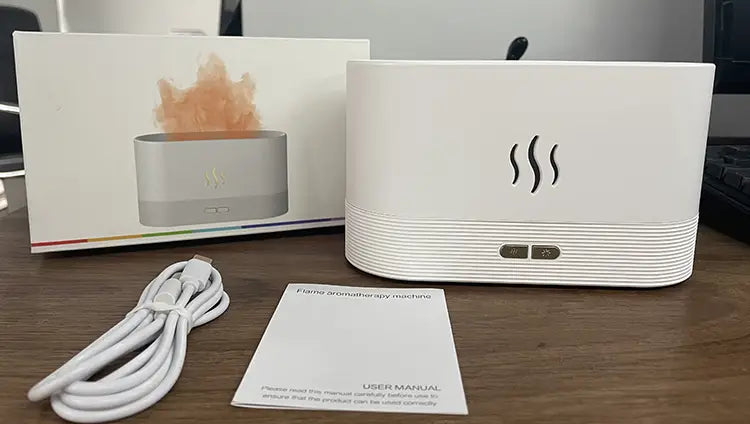 White rectangular flame humidifier rgb essential oil aroma diffuser with horizontal ridged texture and three wavy line vents on the front designed for aromatherapy and essential oil diffusion.