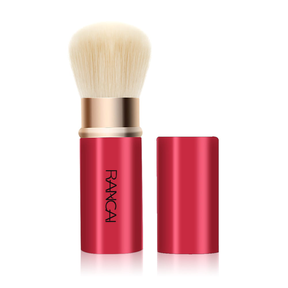 Retractable makeup brush mini rancai in red with a fluffy off-white bristle head and gold-toned metal ferrule.