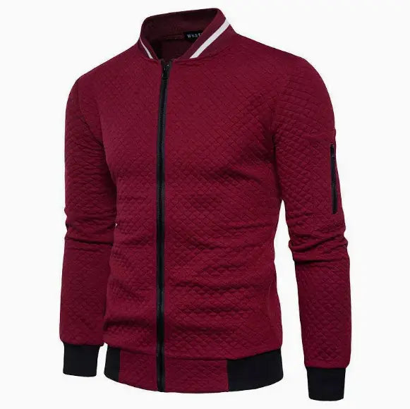 Men’s maroon quilted colorblock bomber jacket with black ribbed cuffs collar trim and waistband featuring a stand collar.